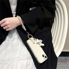 Camellia Flower and Puppy Pearl Charm Leather Crossbody Lanyard Phone Case for iPhone 12 Series